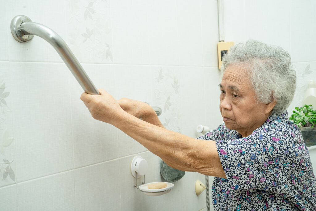 asian senior elderly old lady woman patient use handle security with help support assistant nursing hospital ward healthy strong medical concept